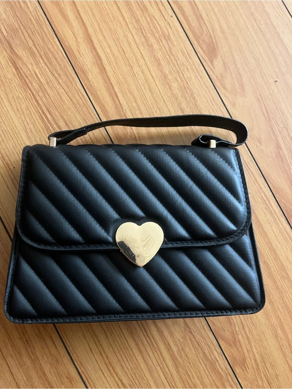 Black Quilted Shoulder Bag with Gold Heart Accent